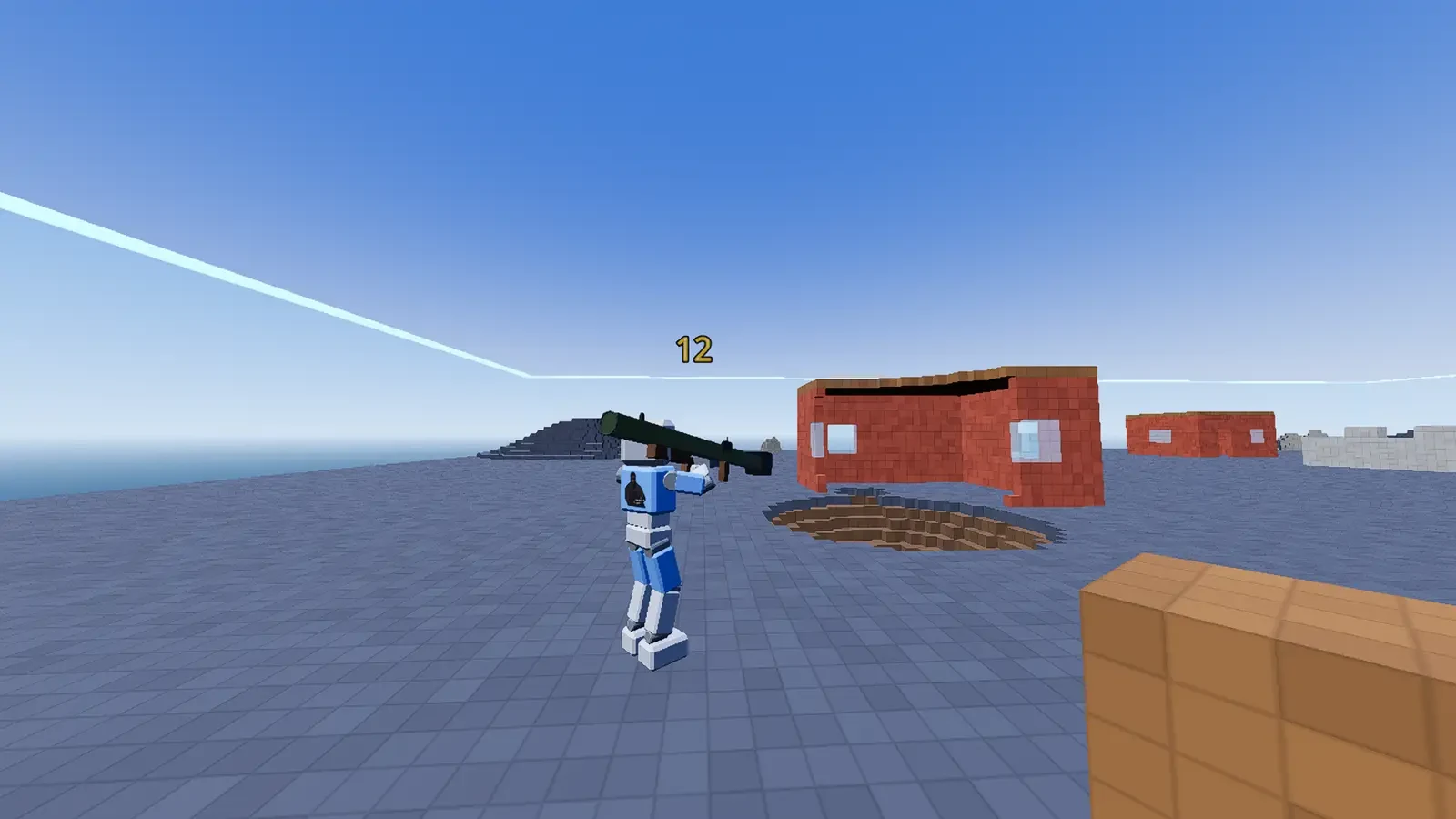 Player aiming a long gun in a voxel arena with a damage number on screen